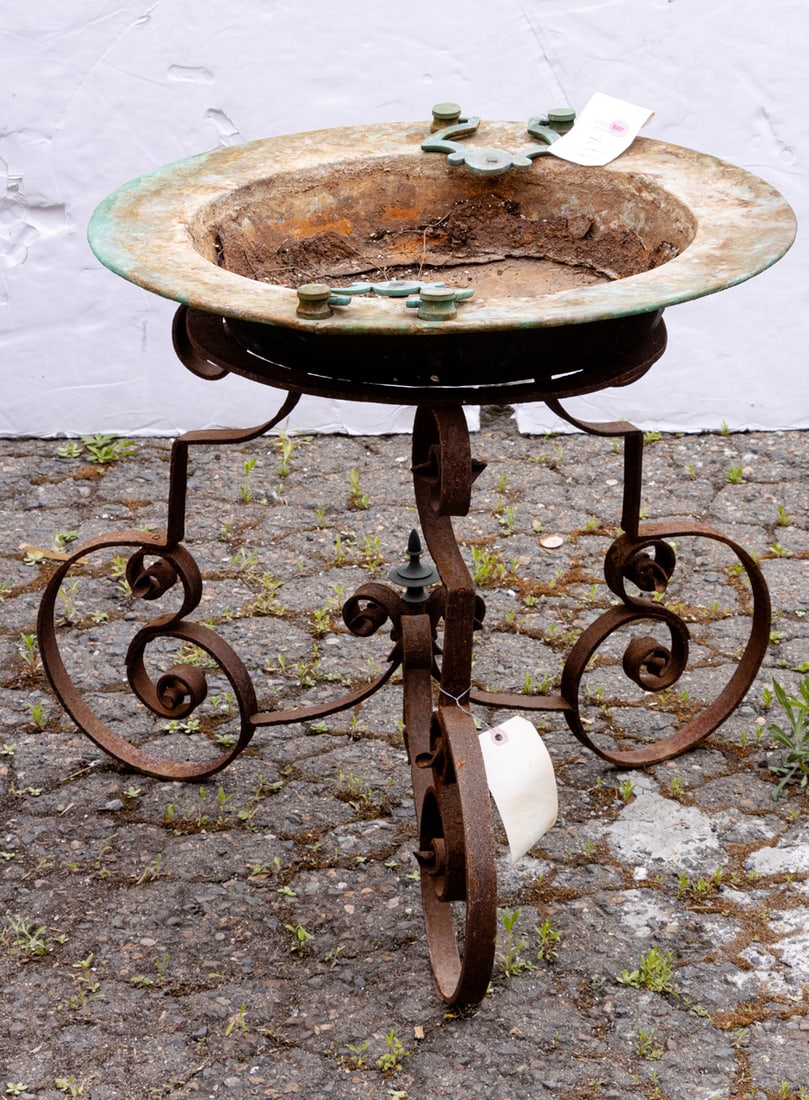 A wrought iron and metal bird bath (1 of 1)