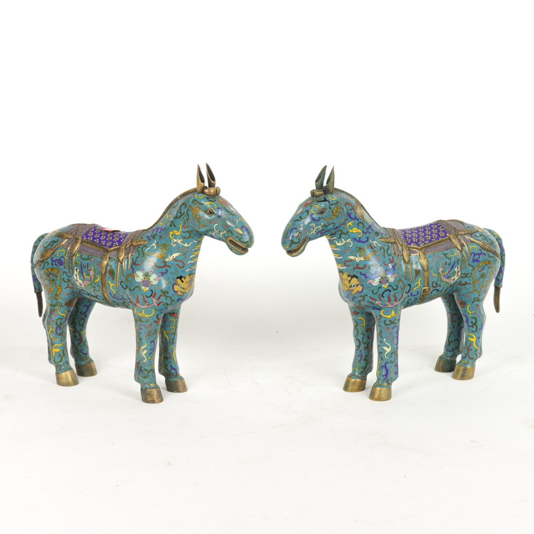 A pair of Chinese cloisonne enamel horse figures: A pair of Chinese cloisonne enamel horse figures. Republic period, 9" high.