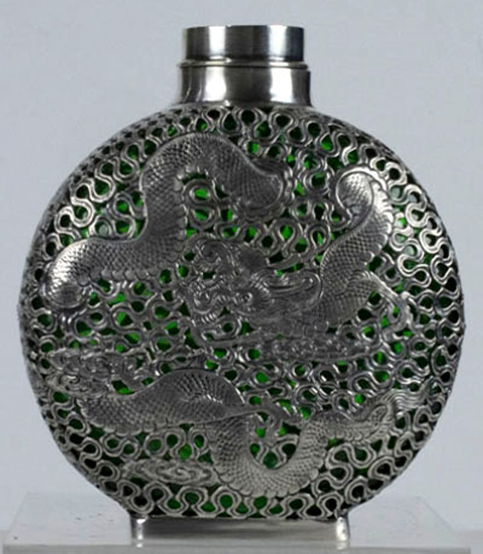 A Ling Hing sterling overlay green glass covered moon form vessel: A Ling Hing sterling overlay green glass covered moon form vessel. Circa 1930, underside with marks 'Modern Hong Kong Lee Hing' and 'Sunset Applied For', 6.75"h x 5.5"w