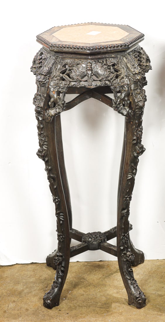 A Chinese octagonal rosewood stand with marble top: A Chinese octagonal rosewood stand with marble top. Late 19th century, 35.5" high.