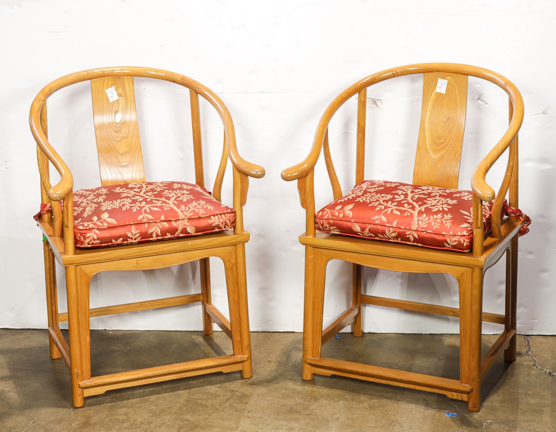 A pair of Chinese elm horse-shoe back armchairs: A pair of Chinese elm horse-shoe back armchairs. 20th century, 38.5"h x 23.75"w x 18"d.
