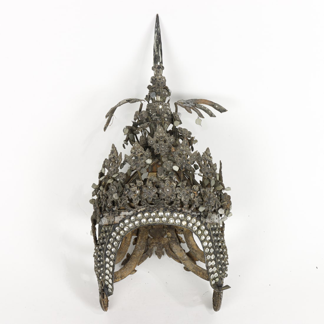 Siamese Chada/Mongkut Headdress, circa 1930s: Siamese Chada/Mongkut Headdress. Circa 1930s, a traditional Thai royal headdress featuring a multi-tiered vertical spire (mongkut) symbolizing Mount Meru. It is decorated with intricate mirrored glass