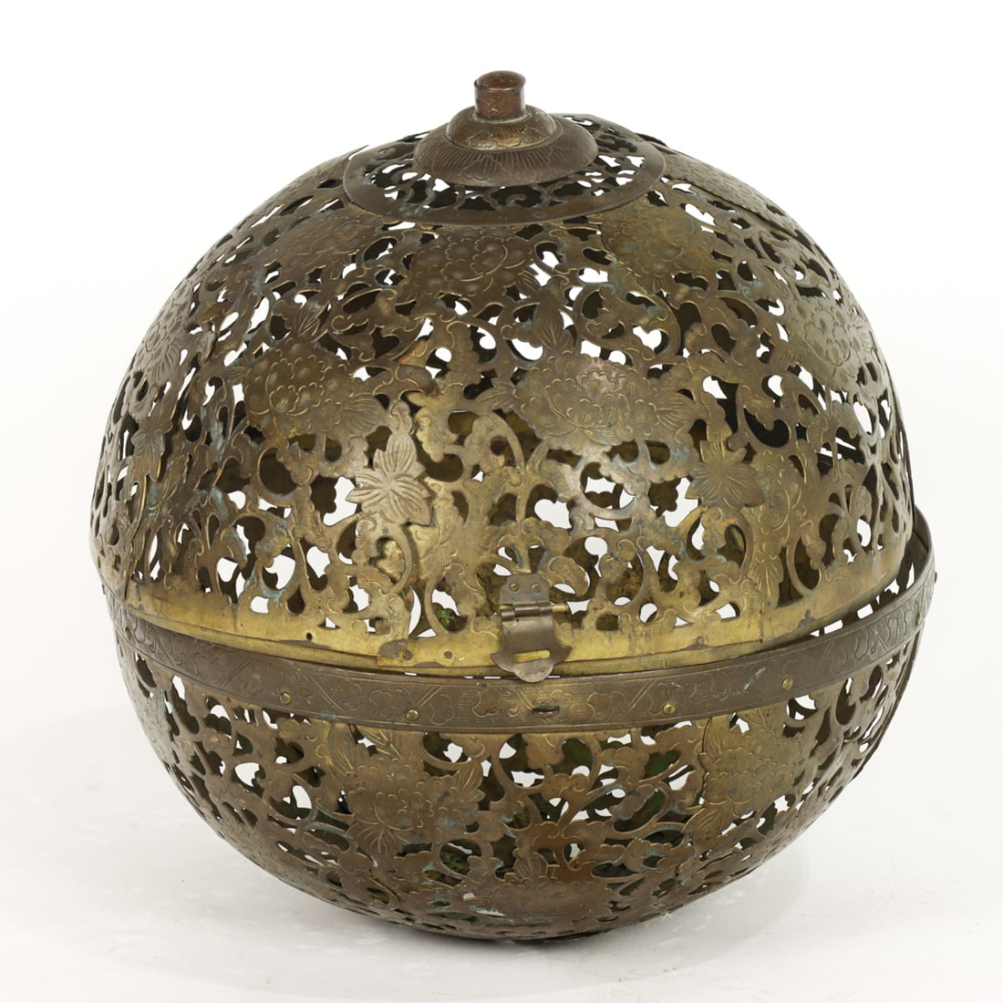A Chinese pierced and engraved brass globe lamp shade: A Chinese pierced and engraved brass globe lamp shade. Early 20th century, 10.5" wide.