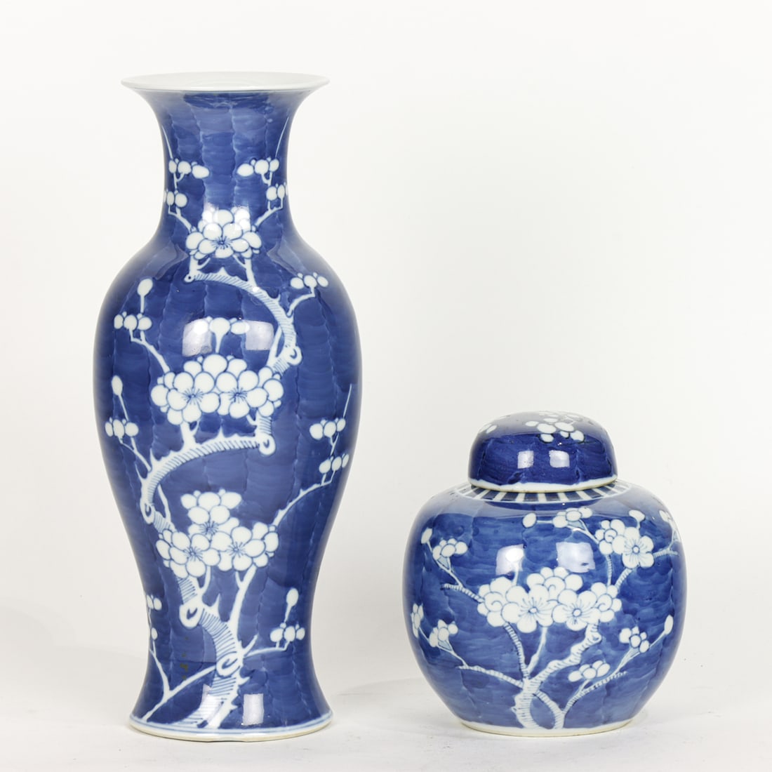 (lot of 2) Chinese blue and white prunus vessels: (lot of 2) Chinese blue and white prunus vessels. Early 20th century, 6" and 12" high.