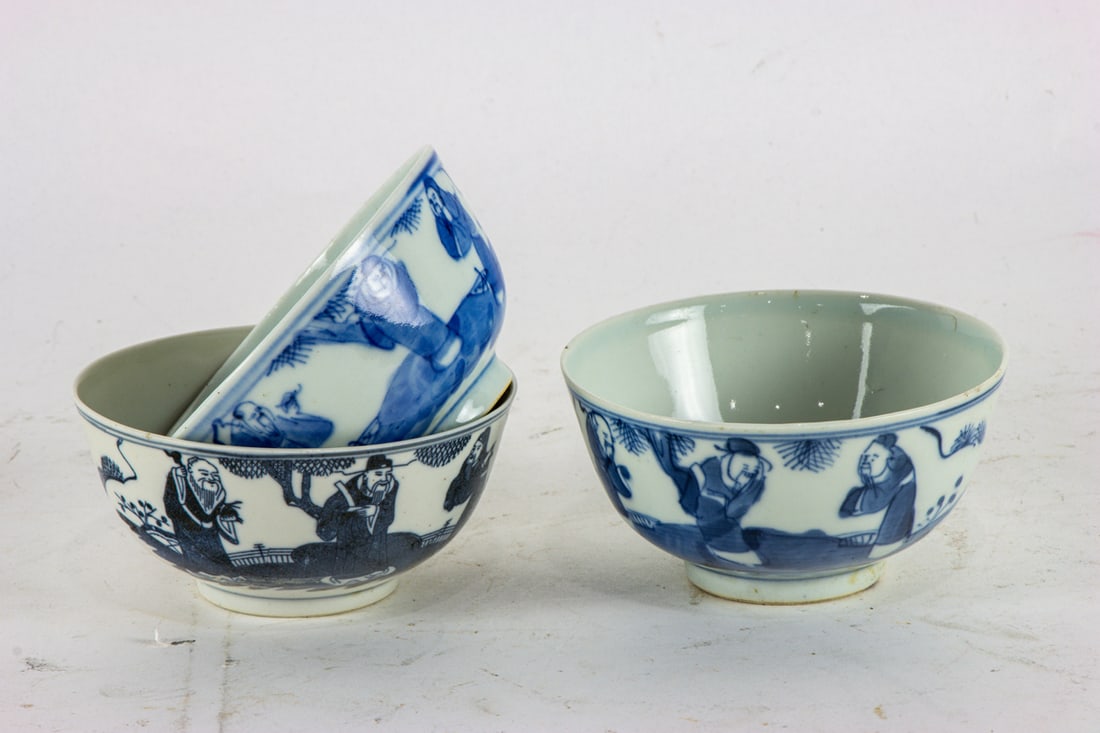 A large group of Chinese blue and white 'Three Immortals' bowls (1 of 2)