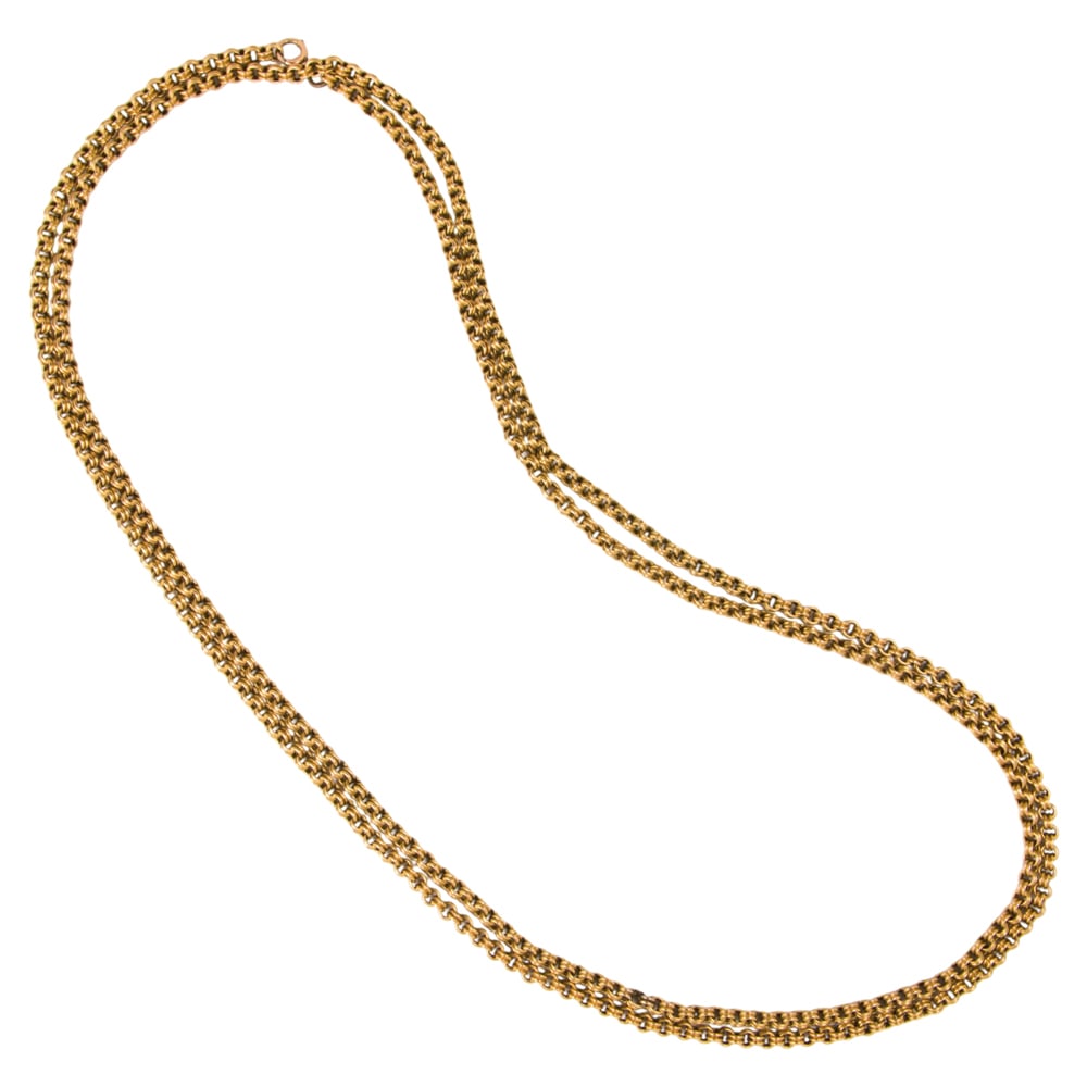 An antique 15k gold muff chain: An antique 15k gold muff chain of double rolo-link design; length: 62 in; 49.70 grams