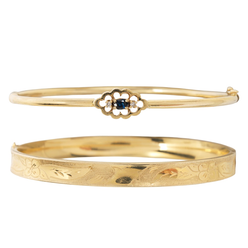 Two antique 14k gold bangle bracelets: Two antique 14k gold bangle bracelets one set with an oval-cut sapphire, framed on either side by one single-cut diamond, and one concave design with ornate etching; widths: 2 3/8 in; gross weight: