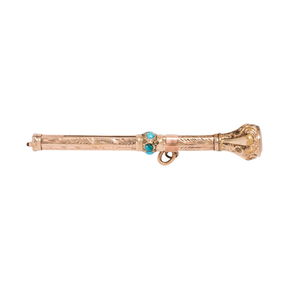 An antique turquoise and 10k gold retractable pencil: An antique turquoise and 10k gold retractable pencil The pencil featuring intricate etching, accented with seven round shaped turquoise cabochons; length (extended): 3 in; 4.85 grams
