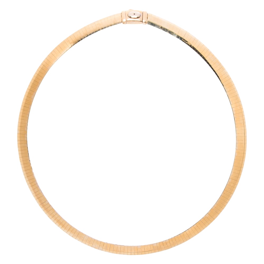 A 14k bi-color gold omega necklace: A 14k bi-color gold omega necklace reversible to yellow and white gold sides: length: 15 in; 34.46 grams