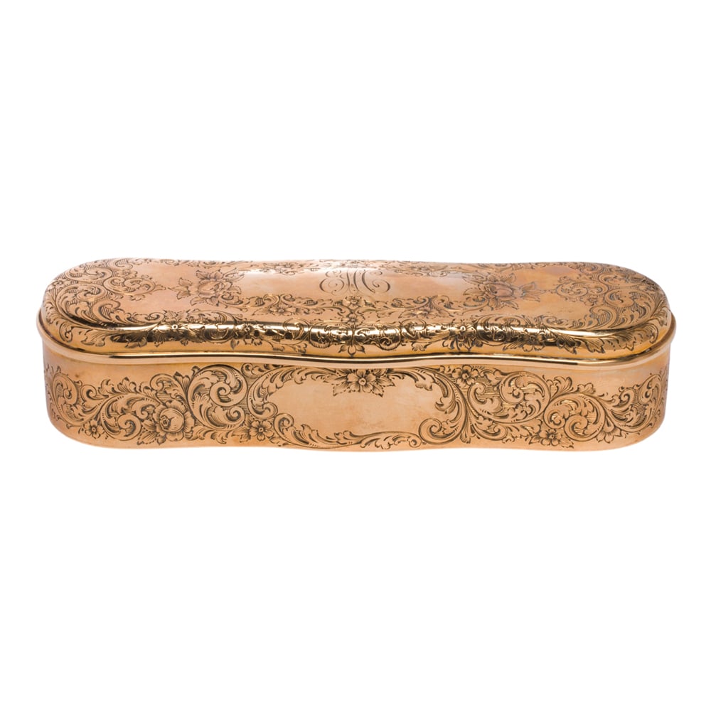 A Shreve & Co. 14k gold dresser box: A Shreve & Co. 14k gold dresser box with monogram and floral and scrolled engraving; length: 5 in; 118.00 grams