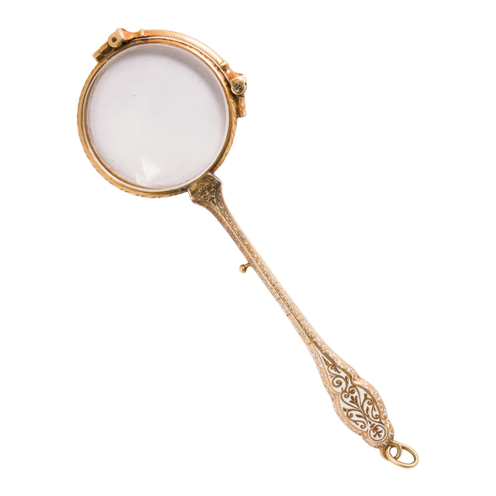 An antique enamel and 14k gold lorgnette: An antique enamel and 14k gold lorgnette designed with intricate white enamel scrollwork; length (closed): 5 1/2 in; 32.40 grams