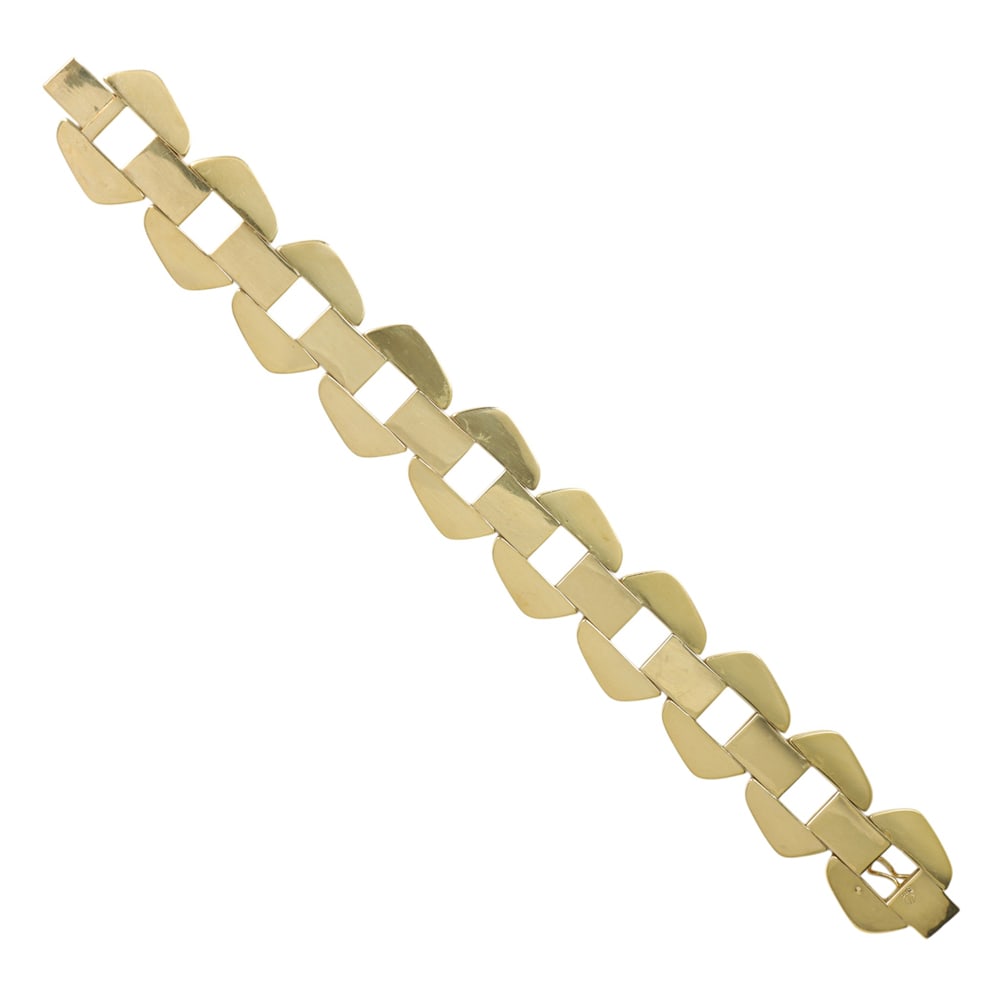 A 14k gold bracelet: A 14k gold bracelet Of hollow-form design, featuring a florentine finish; length: 7 in; 34.05 grams