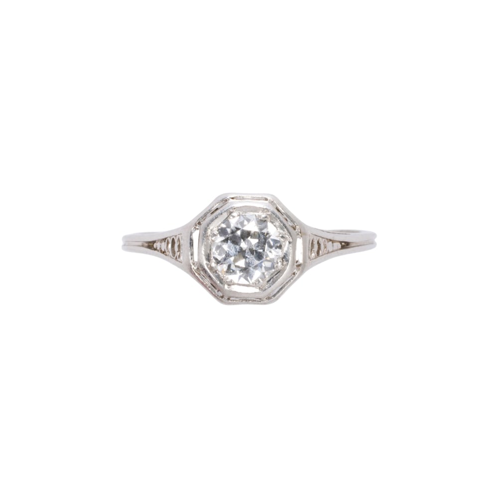 An Art Deco diamond and platinum ring: An Art Deco diamond and platinum ring the open-work ring centering old European-cut diamond weighing approximately 0.30 carat; size: 5 1/5; 2.50 grams