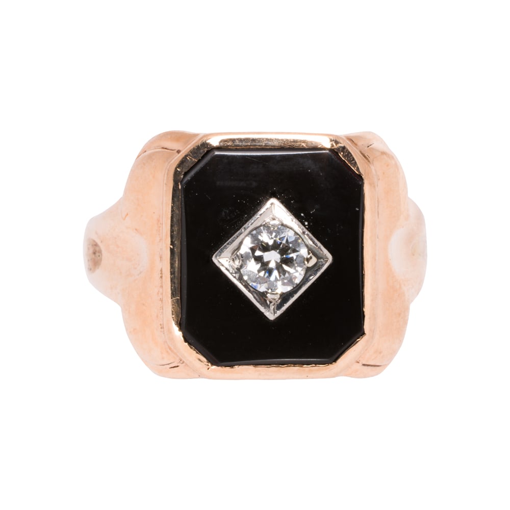 An onyx, diamond, and 14k gold ring: An onyx, diamond, and 14k gold ring Featuring an onyx tablet measuring 13.75 x 11.53 mm, accented by one transitional-cut diamond; size 11;