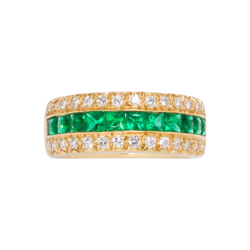 A tsavorite garnet, diamond, and 18k gold ring: A tsavorite garnet, diamond, and 18k gold ring Designed as a row of 11 square-cut tsavorite garnets measuring 2.61 x 2.46 x 2.23 mm, framed by round brilliant-cut diamonds weighing a total of