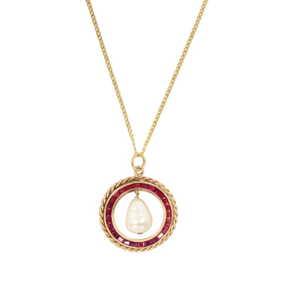 A synthetic ruby, cultured pearl, and 14k gold pendant necklace: A synthetic ruby, cultured pearl, and 14k gold pendant necklace Of wreath design, set with 25 square-cut synthetic rubies and one baroque cultured pearl measuring 13.88 mm long, on modified curb link 