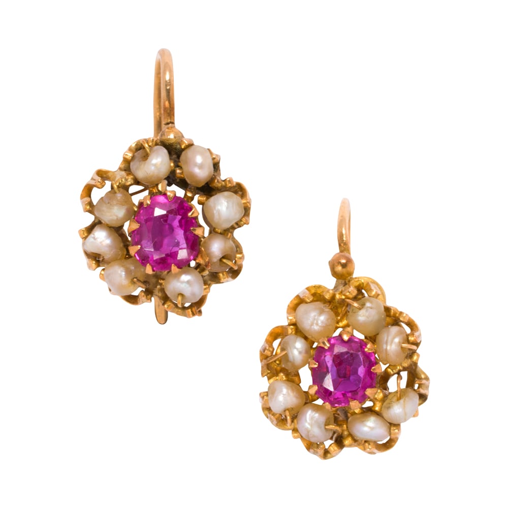 A pair of ruby, cultured pearl, and high karat gold earrings: A pair of ruby, cultured pearl, and high karat gold earrings Centering oval-cut rubies weighing approximately 0.65 carat each, framed by seed cultured pearls measuring approximately 3.02 mm; length: