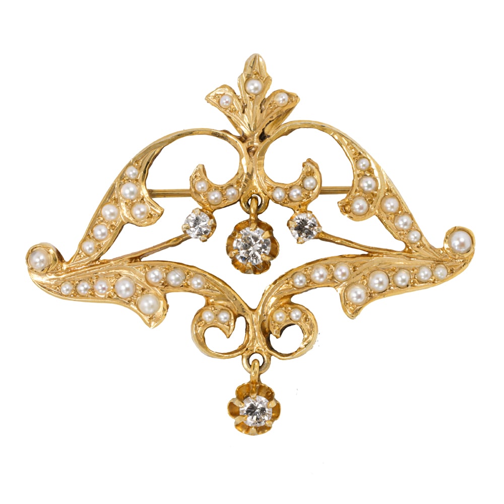 A seed pearl, diamond and 14k gold brooch-pendant: A seed pearl, diamond and 14k gold brooch-pendant featuring four round brilliant-cut diamonds weighing in total approximately 0.35 carat, accented throughout with numerous seed pearls; measuring: 1