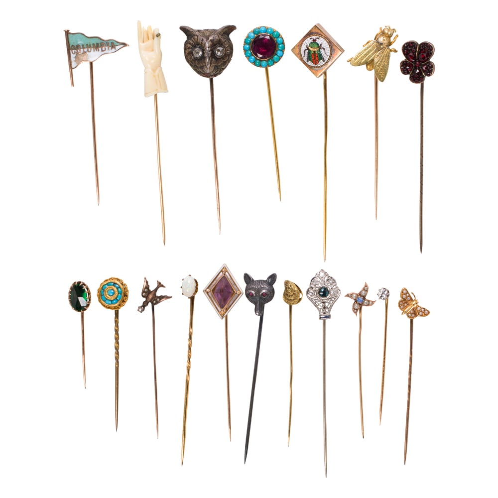 A collection of gem-set stickpins: A collection of gem-set stickpins comprising 18 pins variously set with stones including diamonds, sapphire, amethyst, micromosaic, turquoise, garnet, opal, seed pearl, bone, and enamel, in 9k-14k
