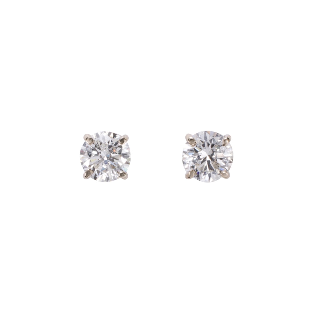A pair of diamond and 14k white gold stud earrings (1 of 1)