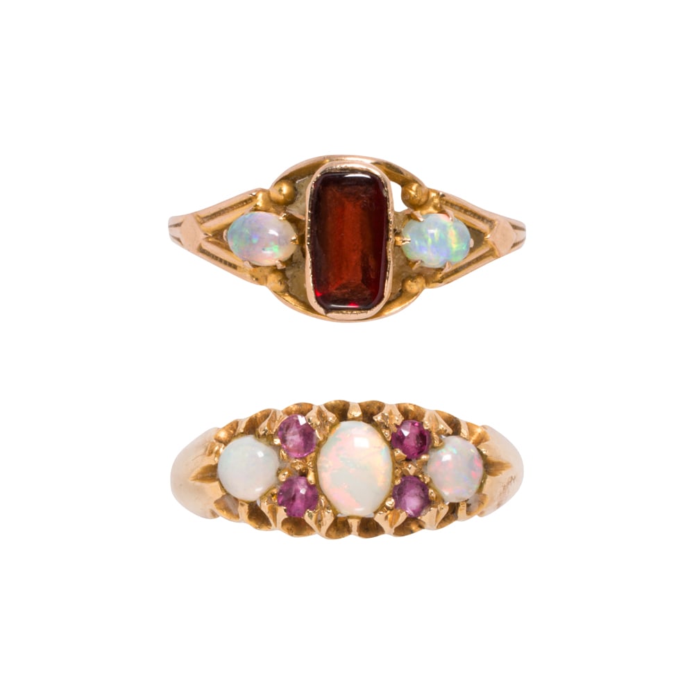 Two antique garnet, opal, and gold rings: Two antique garnet, opal, and gold rings Comprising one 14k gold ring set with a pavilion-cut garnet cabochon measuring 7.04 x 3.74 mm, accented by two oval-cut opal cabochons, together with an 18k