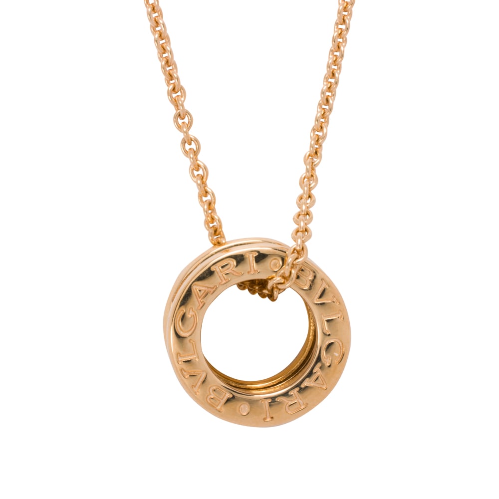 A Bulgari 18k gold B.zero1 pendant-necklace: A Bulgari 18k gold B.zero1 pendant-necklace Featuring a cylindrical B.zero1 pendant; pendant width: 1/4 in; pendant height: 1/2 in; chain length: 16 in; 11.55 grams
