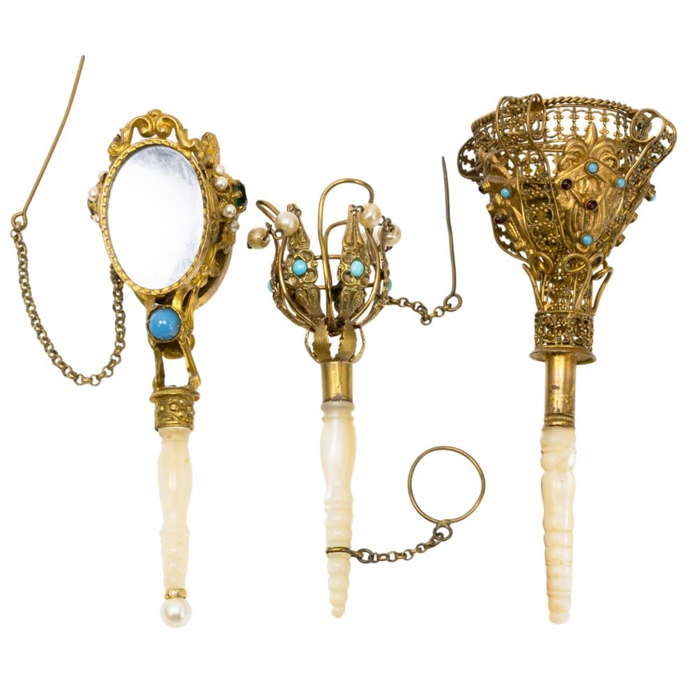 Three Italian and English gilt metal posy holders or tussie mussies: Three Italian and English gilt metal posy holders or tussie mussies, circa 1860-1880, comprising Italian holders with two flirting mirrors and two English holders with enamel and faux pearl beads,
