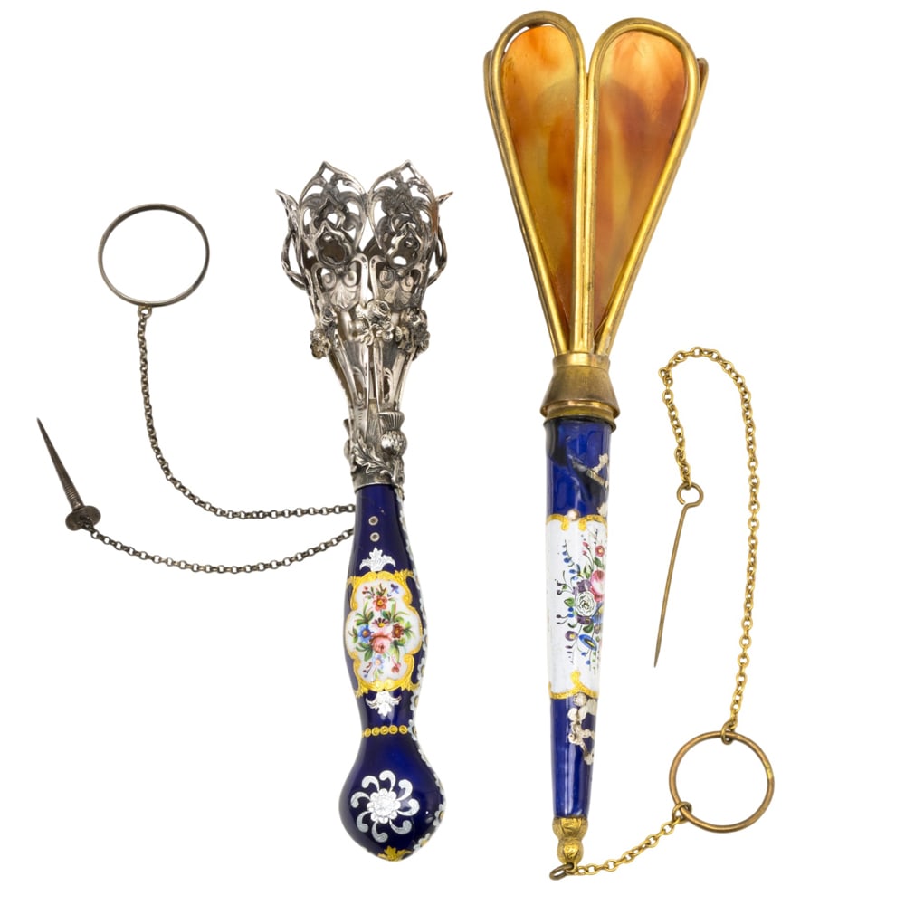 Two French enamel decorated posy holders or tussie mussies: Two French enamel decorated posy holders or tussie mussies, circa 1870-1880, one with tortoiseshell petal cup and one with silver plated cup with thistle design, between 6.5"l and 5.25"l. Provenance: