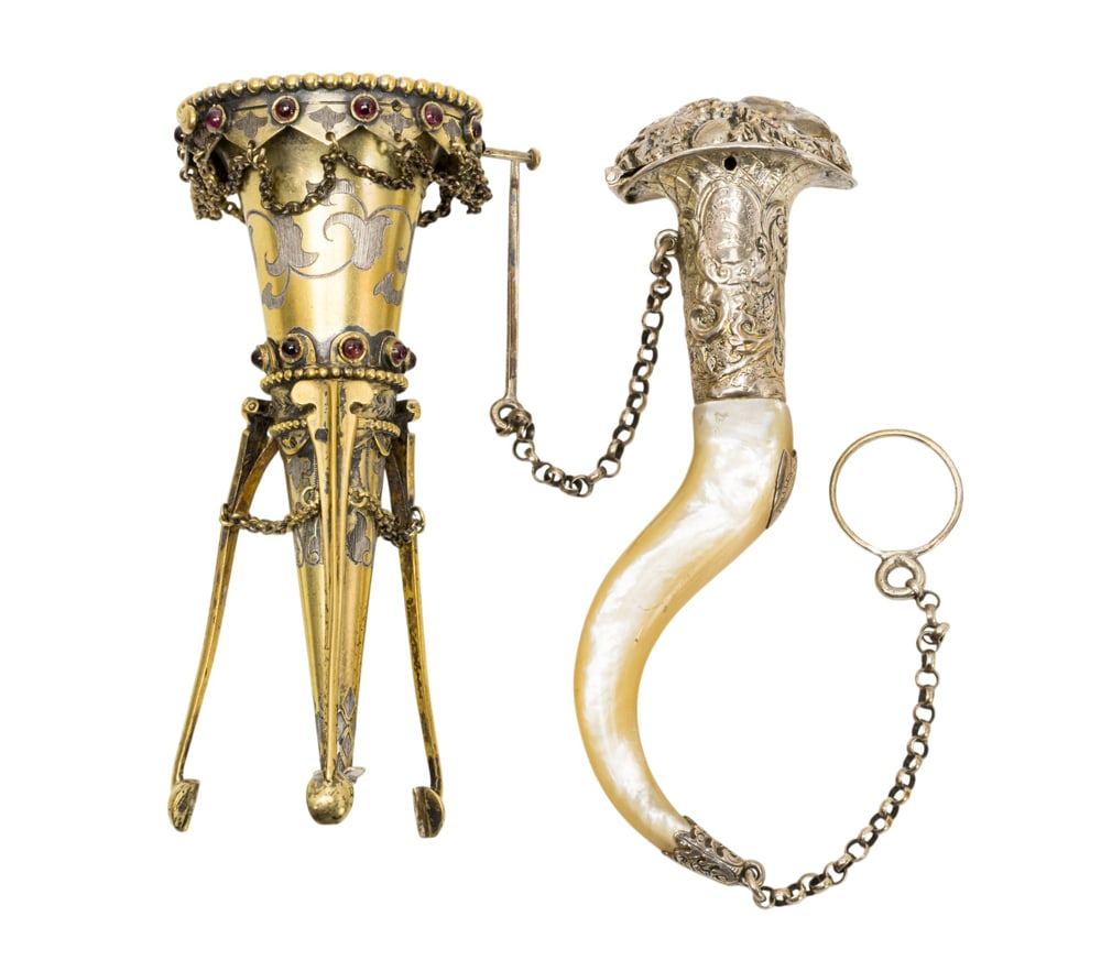 Two silver posy holders or tussie mussies: Two silver posy holders or tussie mussies, circa 1870, the first English cone shaped tripod with red paste jewel, hallmarked for William Neal, London 1872, in original fitted case with retailer