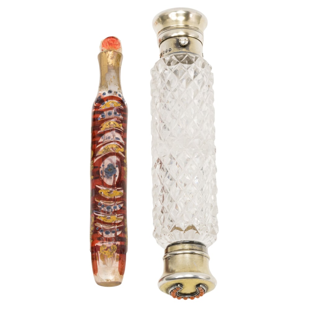 Two European perfume flasks: Two European perfume flasks, 19th century, the first English sterling mounted cut glass double flask with coral mounted horseshoe to each end, hallmarked for Sampson Mordan & Co ., London, 1886; the