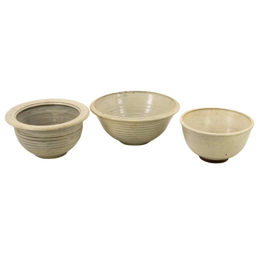 Ceramic Bowls, American School (20th century): (lot of 3) American School (20th century), Ecru Glazed Bowls, ceramic bowls, each unsigned, overall (for largest): 5.5"h x 13.5"w x 13.5"d. Provenance: Property from the Private Collection of Viola