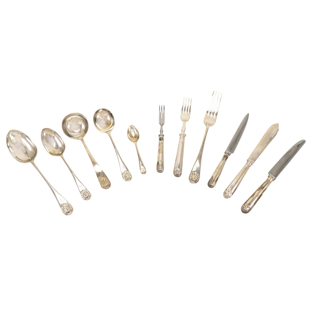 An Elizabeth II silver flatware set, retailed by Garrard & Co: An Elizabeth II silver flatware set, retailed by Garrard & Co., London; by MDQ, Sheffield, 1968-1969, Old English Shell, monogrammed: R, comprising: 12 table forks, 12 dessert forks, 12 dessert spoons