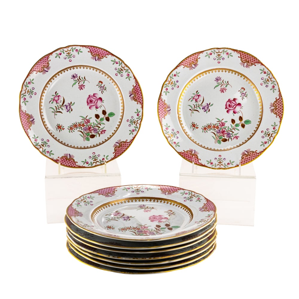 A set of nine Continental porcelain gilt decorated dinner plates in the Chinese famille rose style: A set of nine Continental porcelain gilt decorated dinner plates in the Chinese famille rose style, unmarked, 10.25"dia