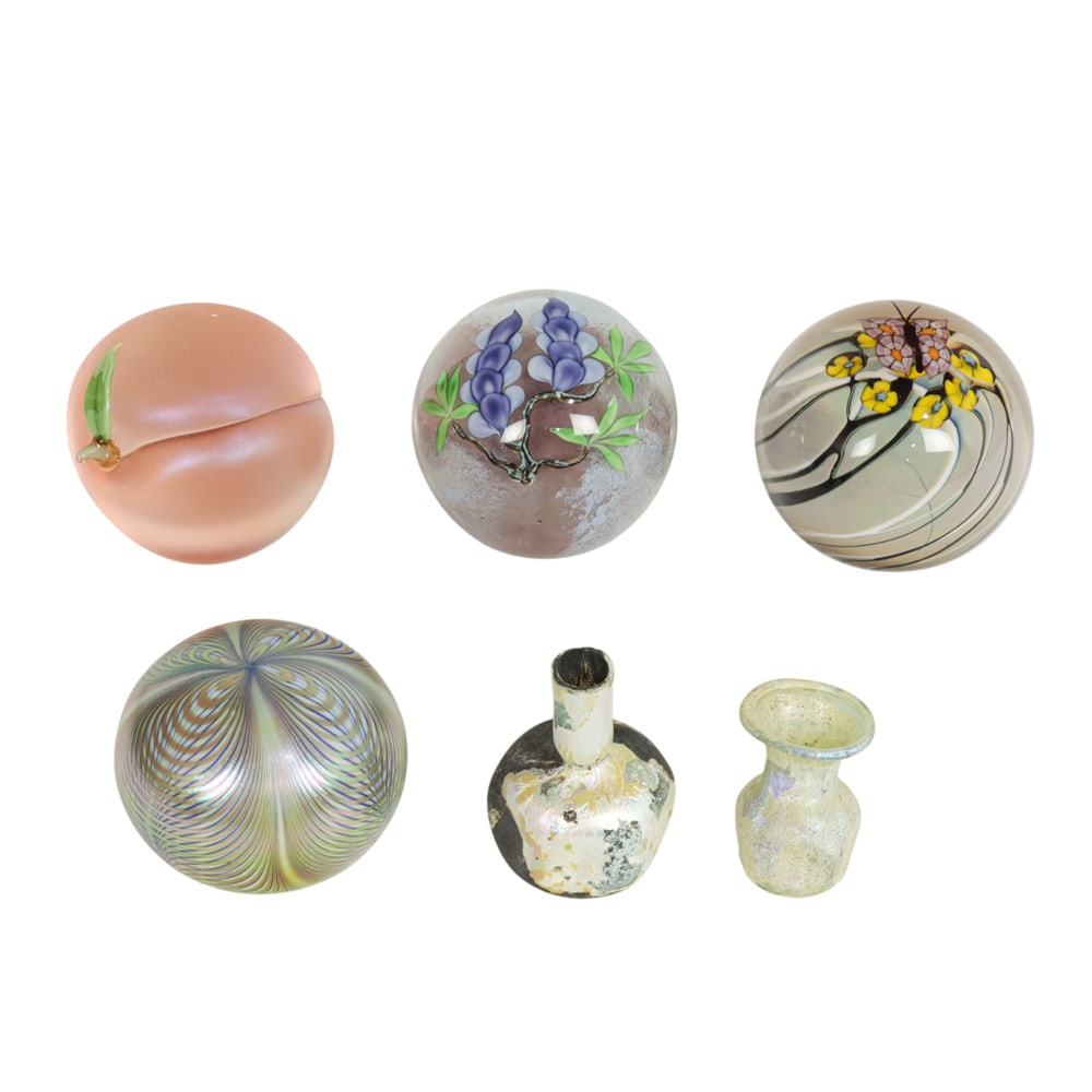 Four American studio glass paperweights: Four American studio glass paperweights, comprising Orient & Flume wisteria paperweight by Ed Seaira, 1981; Orient & Flume flower and butterfly paperweight by Rick Gibbons; Orient & Flume peach paperw