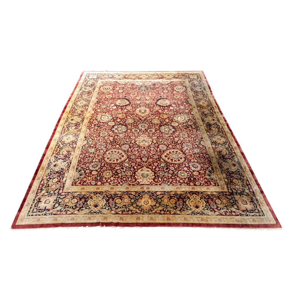 A large antique Persian Kashan carpet: A large antique Persian Kashan carpet, 17'6" x 12'