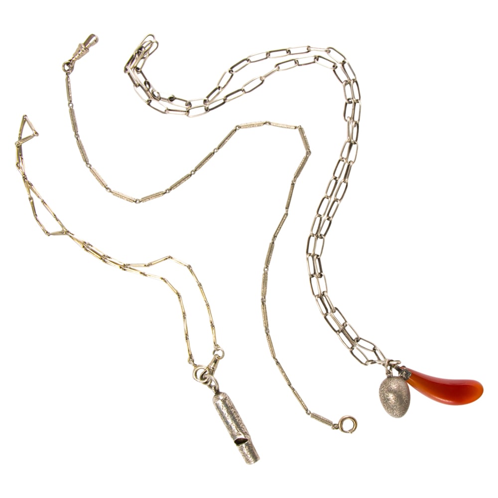 Three antique silver pocket watch chains and fobs: Three antique silver pocket watch chains and fobs Comprising three silver pocket watch chains with a whistle, egg, and horn fobs; gross weight: 40.65 grams