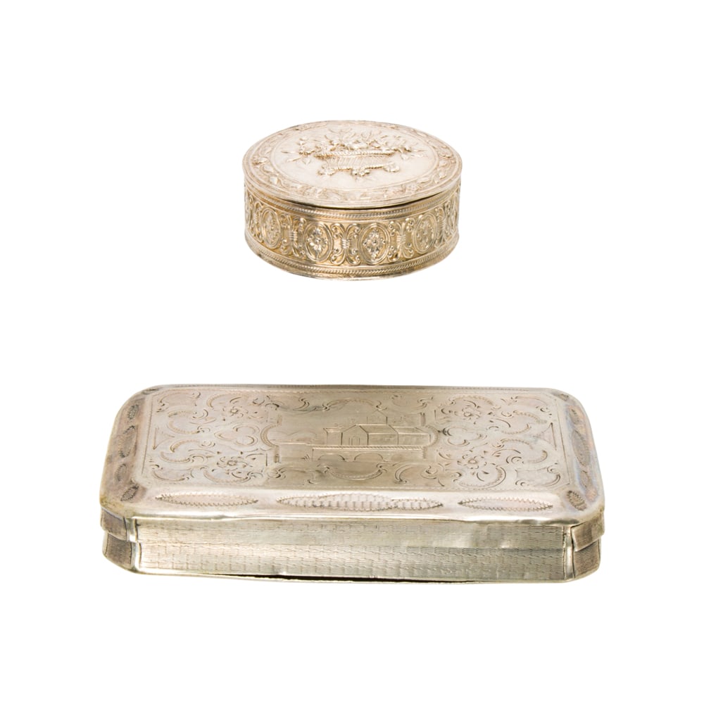 Two silver boxes: Two silver boxes Featuring one rectangular and one circular silver box of varying styles; widths: 2 3/4 and 1 1/4 in, respectively; gross weight: 53.05 grams