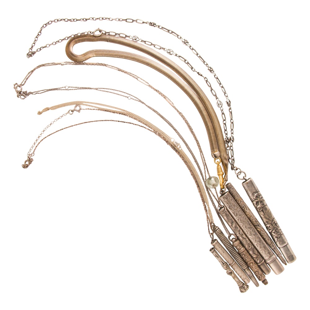 Nine antique silver and silver-tone pencils, pencil holders, and chains: Nine antique silver and silver-tone pencils, pencil holders, and chains The nine mechanical pencil and pencil holders of varying styles; gross weight: 89.65 grams