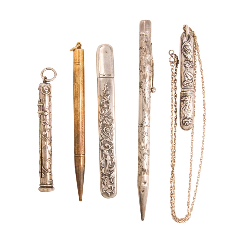 Five antique pencils and pencil holders: Five antique pencils and pencil holders Comprising two mechanical pencils and three pencil holders of varying styles and one silver chain; gross weight: 67.55 grams