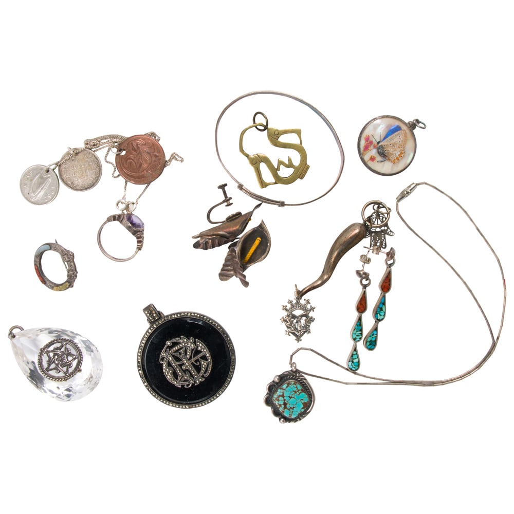 A group of miscellaneous silver and silver-tone jewelry: A group of miscellaneous silver and silver-tone jewelry Comprising an assortment of jewelry of varying styles and materials, including antiques; gross weight: 111.75 grams