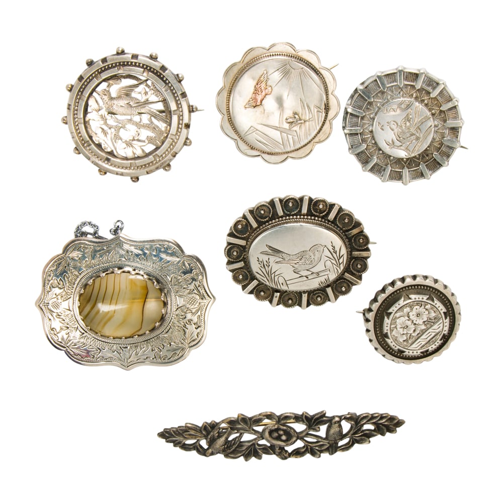 Seven antique brooches: Seven antique brooches The brooches featuring nature-themed imagery; gross weight: 55.45 grams