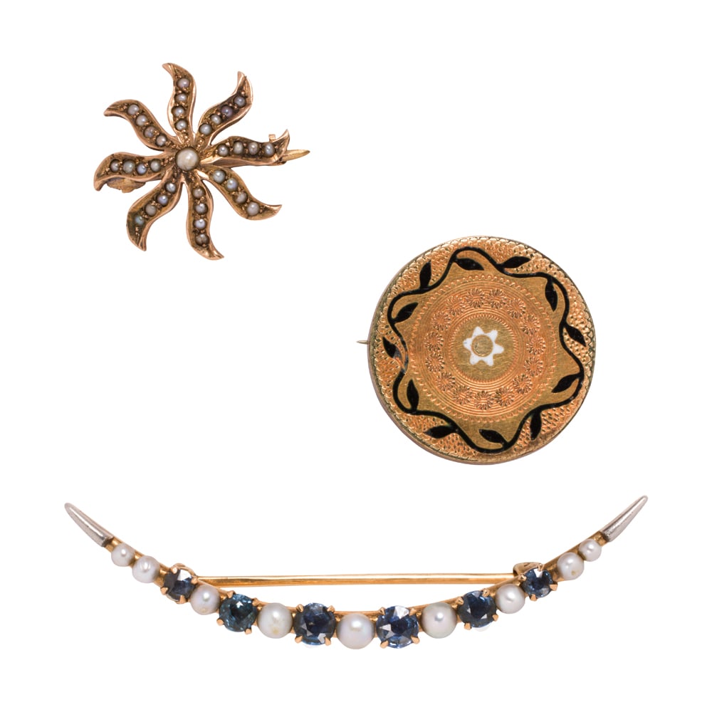 Three antique gold and gold-filled pins: Three antique gold and gold-filled pins Comprising one 14k gold crescent-shaped pin set with six round-cut blue stones interspersed by seed pearls, one starburst pin set with seed pearls, and one