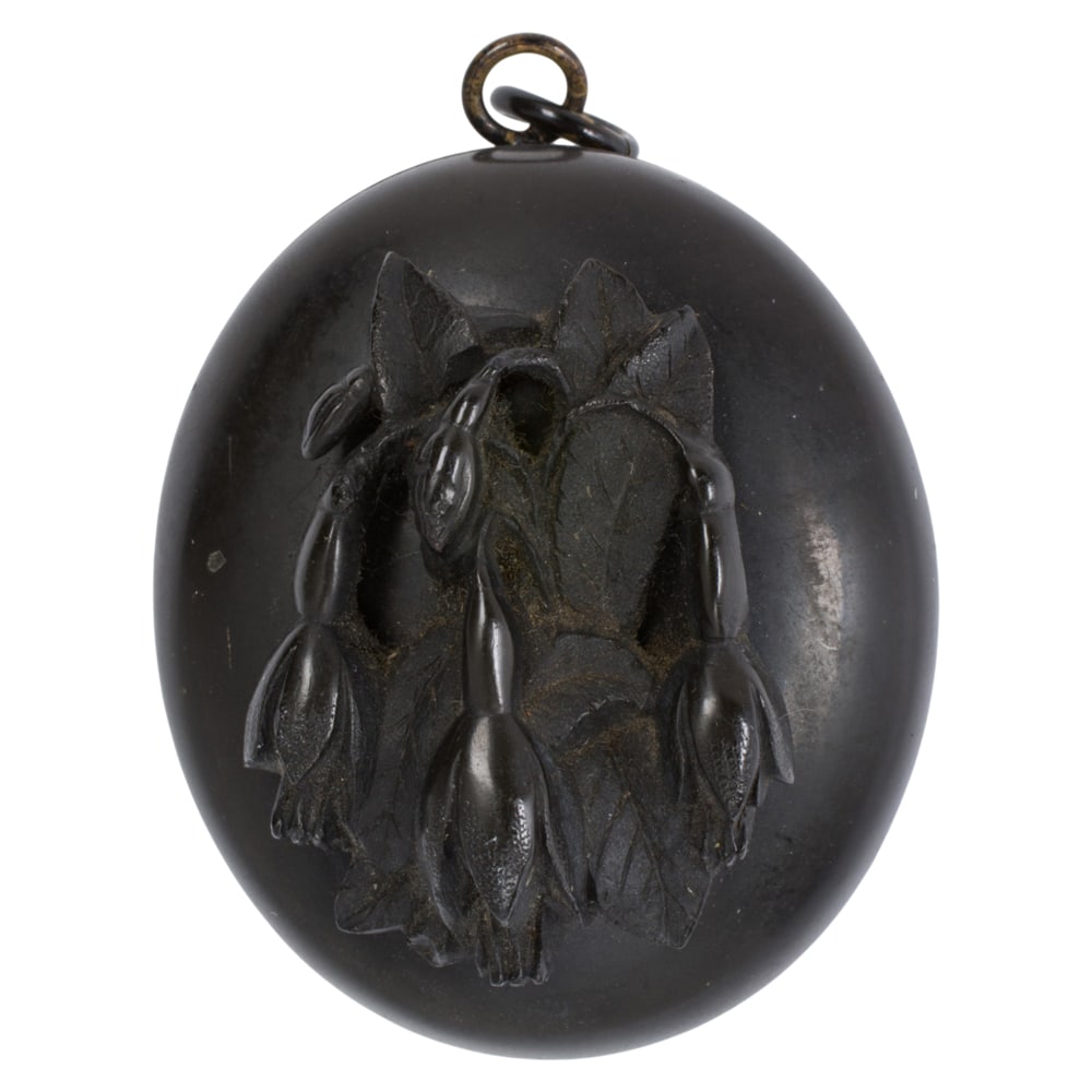 A Victorian gutta percha mourning locket (1 of 1)