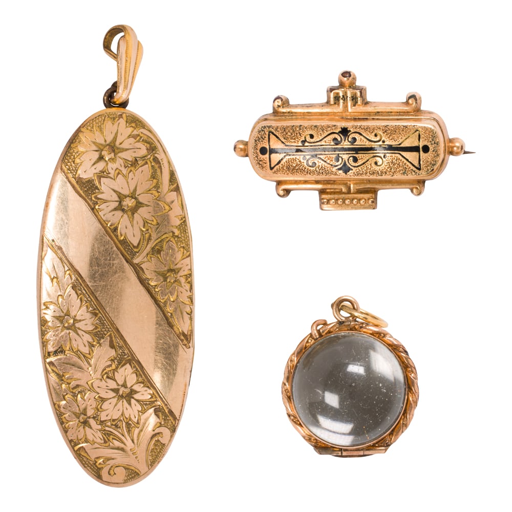 Three 9k gold and gold-filled antique pieces of jewelry: Three 9k gold and gold-filled antique pieces of jewelry Comprising one 9k gold pin together with two gold filled pendants; gross weight: 39.95 grams