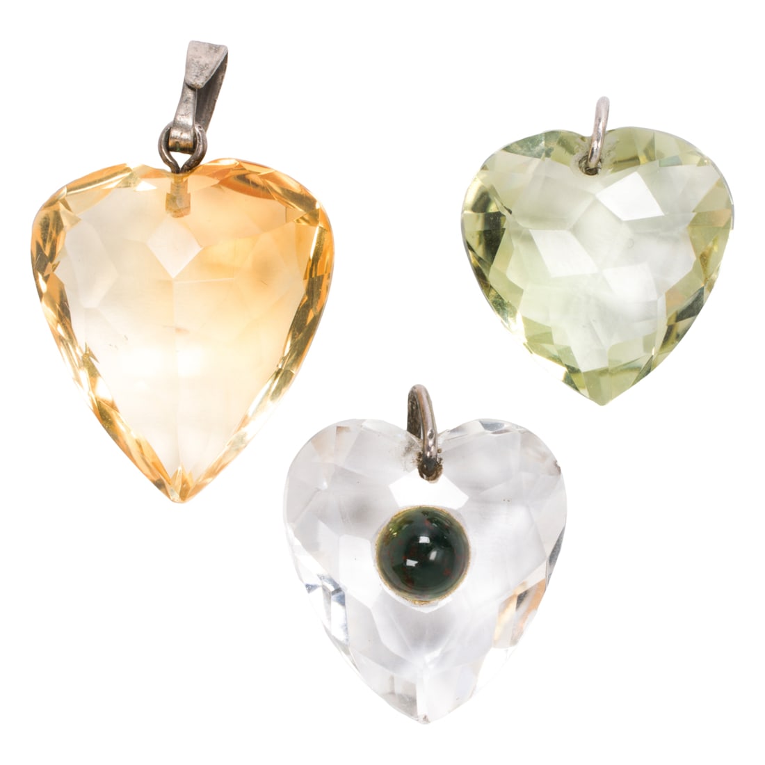 Three hardstone heart pendants: Three hardstone heart pendants Comprising three faceted hardstone hearts of varying materials including citrine; gross weight: 8.90 grams