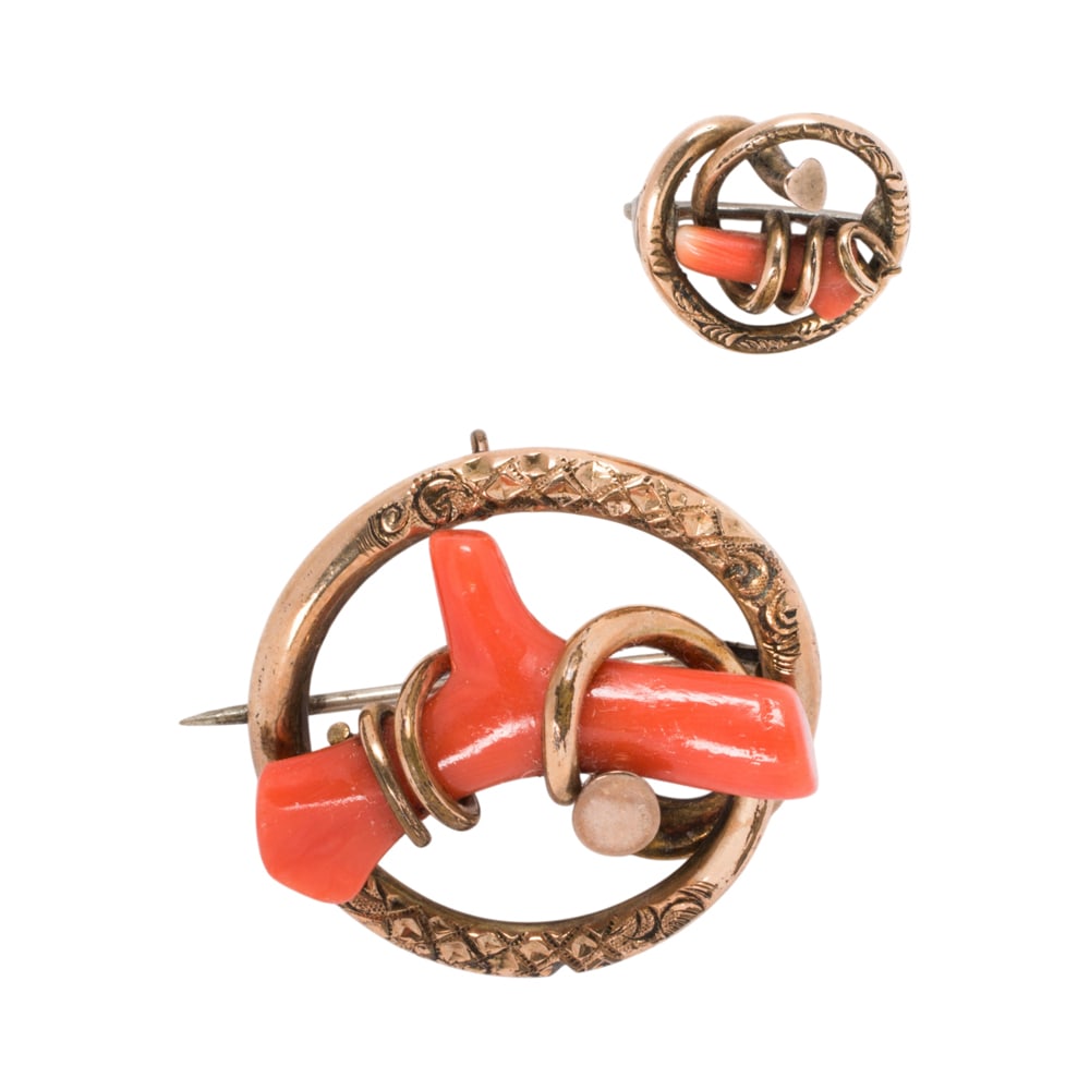 Two Victorian coral and gold pins: Two Victorian coral and gold pins Designed as love knots, featuring polished coral branches wrapped in 10k and 14k gold; lengths; 1 1/8 and 5/8 in, respectively; gross weight: 9.40 grams