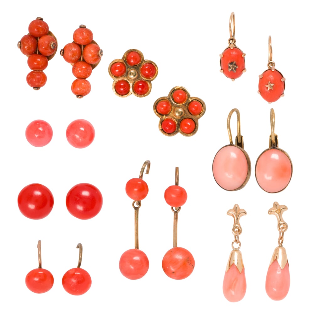 Sixteen pairs of gold and gold-tone coral earrings: Sixteen pairs of gold and gold-tone coral earrings The coral earrings set within varying materials including 10k gold, 14k gold, and silver; gross weight: 17.00 grams