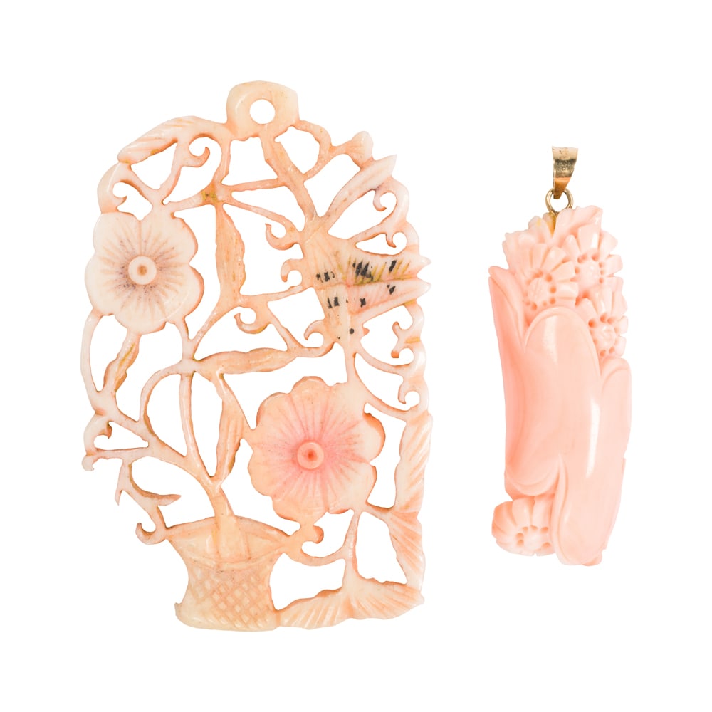 Two carved coral pendants: Two carved coral pendants Comprising one pendant set with 14k gold bail, together with an open-form carved coral pendant; lengths: 1 3/4 and 2 1/4 in, respectively; gross weight: 12.45 grams