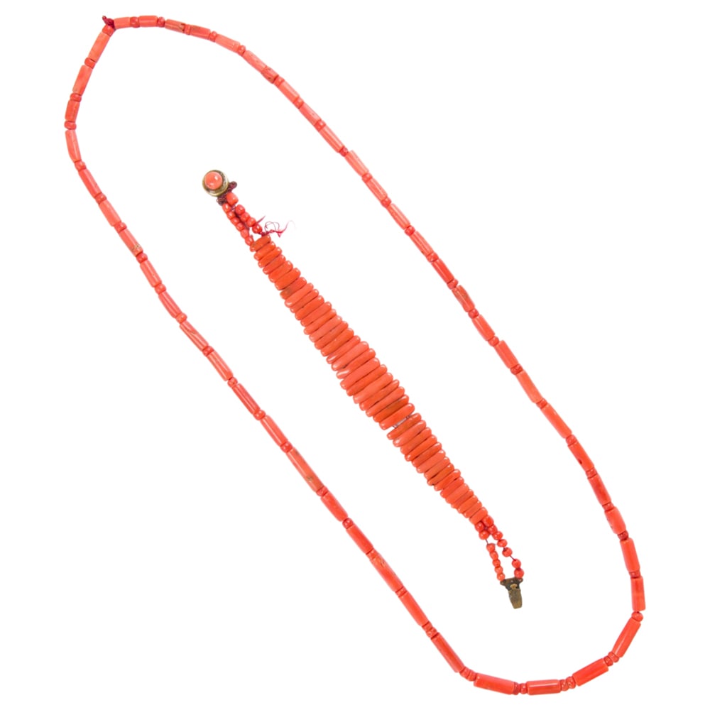 An antique coral and gold-filled bracelet and necklace: An antique coral and gold-filled bracelet and necklace Comprising one bracelet and one necklace set with coral beads of varying shapes and sizes; bracelet length: 8 in; necklace length: 26 in; 44.60