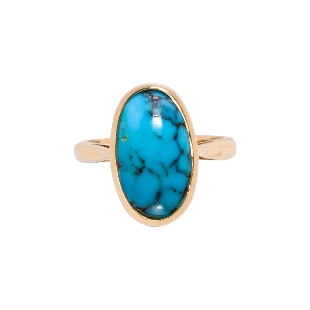 A turquoise and 15k gold ring: A turquoise and 15k gold ring Set with one oval shaped turquoise cabochon measuring 14.40 x 8.55 x 4.44 mm; size 5 1/2; 4.45 grams
